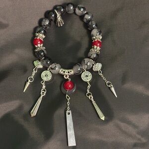 Beaded bracelet with charms